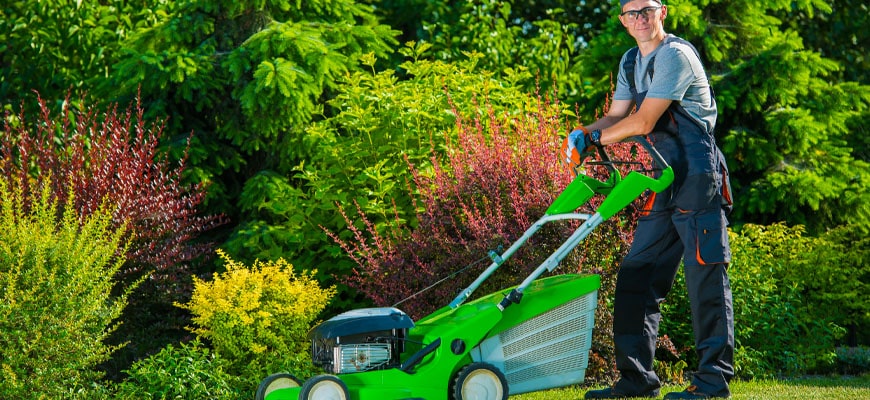 Man mowing his front lawn