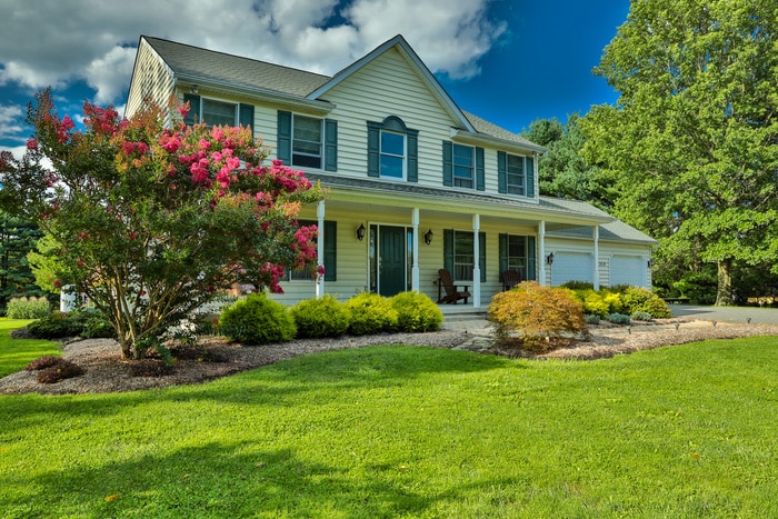 a house with a beautiful lawn after lawn services